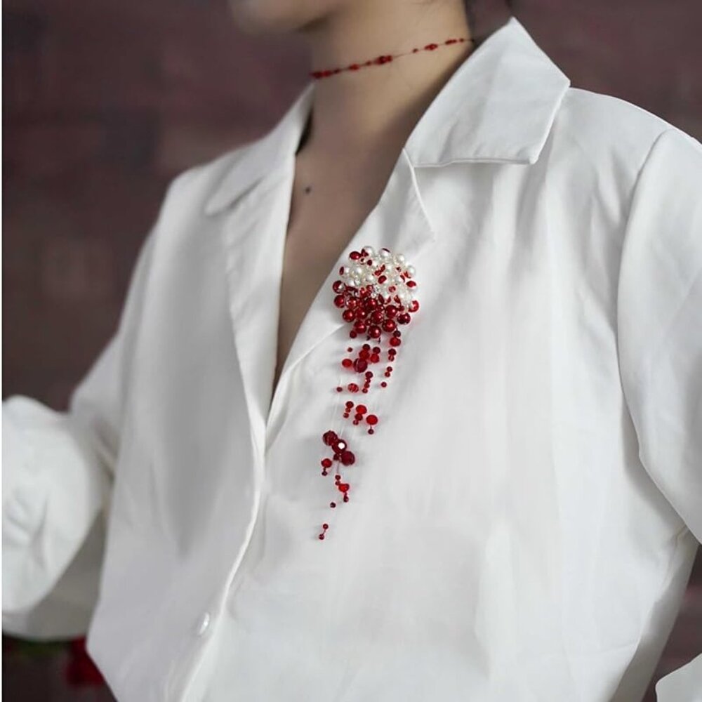 Blood pearl brooch